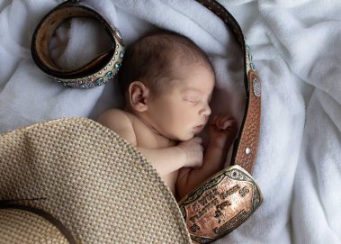 newborn with western belt
